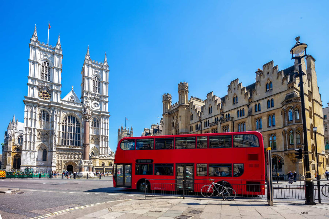 Red double-decker bus in front of Westminster Abbey in London