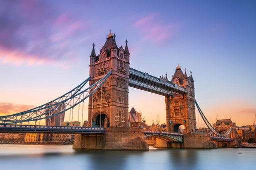 Tower Bridge in London during sunset with a colorful sky.